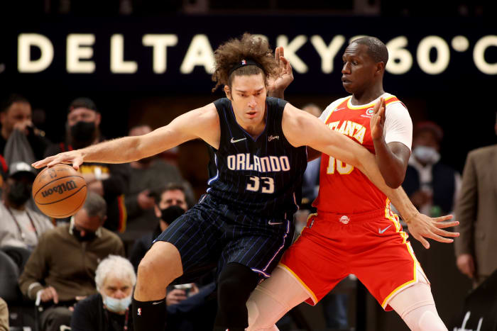 Orlando Magic center Robin Lopez (33) makes a move against Atlanta Hawks center Gorgui Dieng (10) during the first quarter at State Farm Arena.